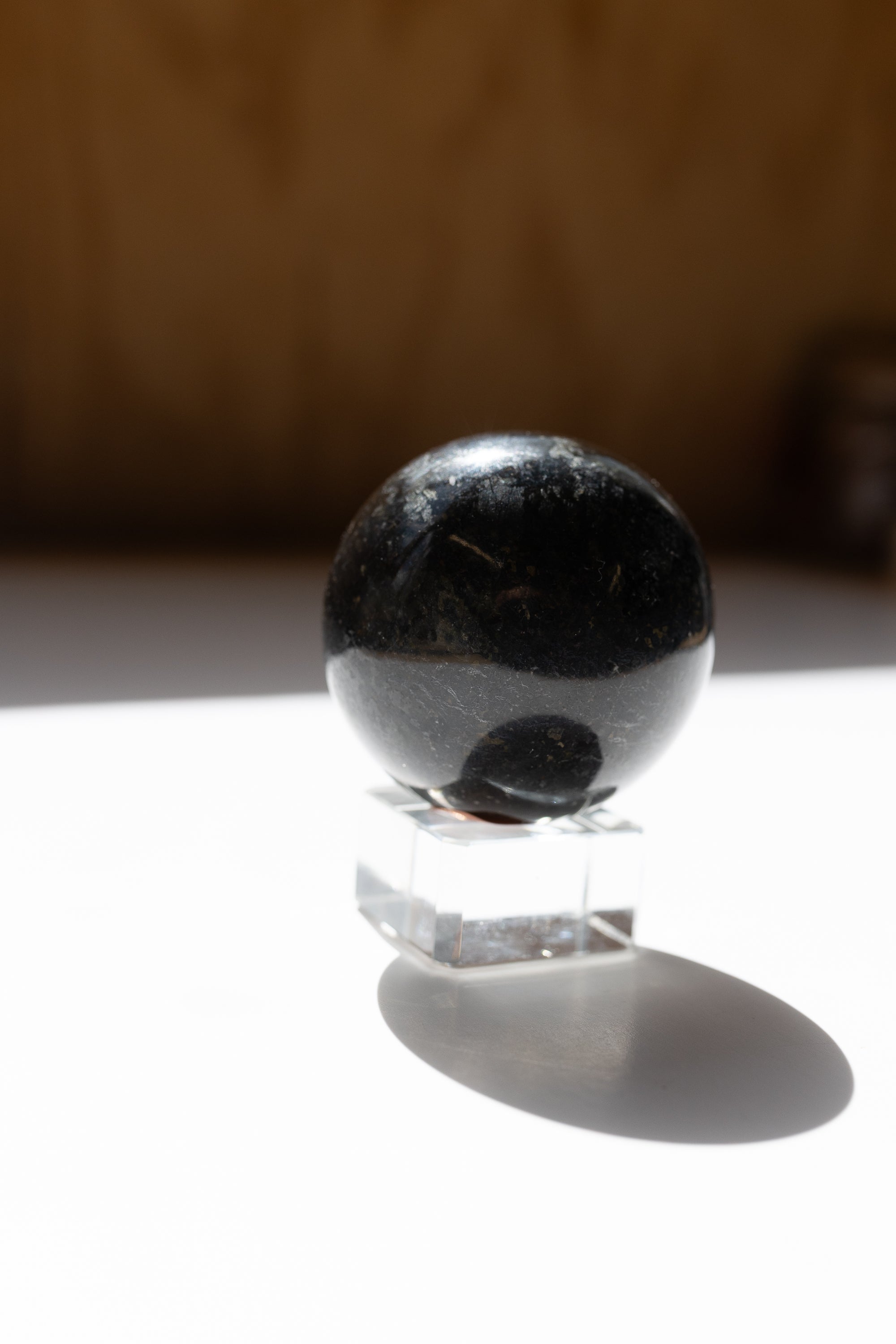 Nuummite Crystal Sphere #1 | Transformation • Psychic Protection • Ancient Wisdom