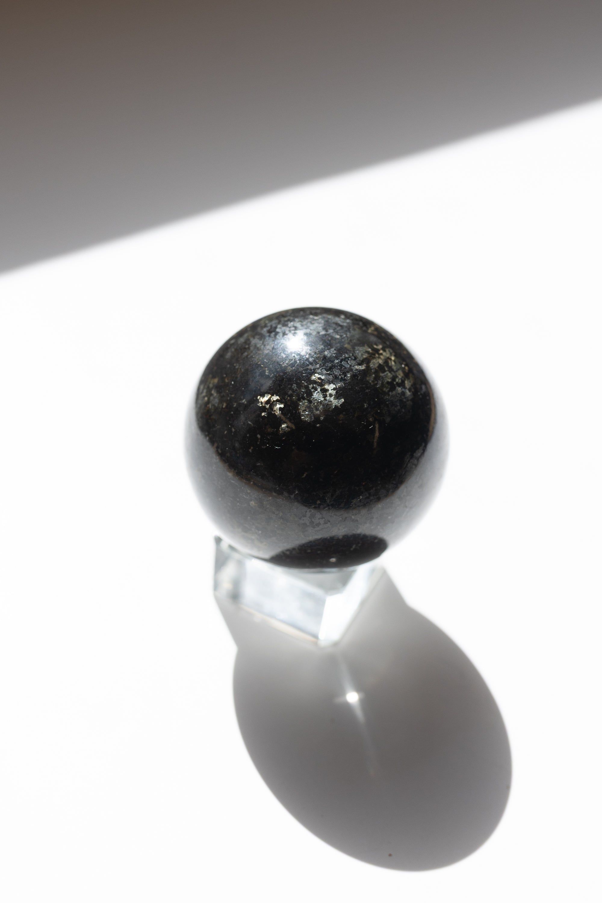 Nuummite Crystal Sphere #1 | Transformation • Psychic Protection • Ancient Wisdom