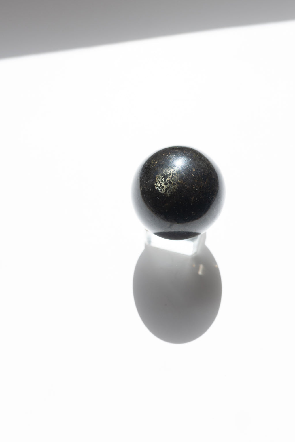 Nuummite Crystal Sphere #2 | Transformation • Psychic Protection • Ancient Wisdom