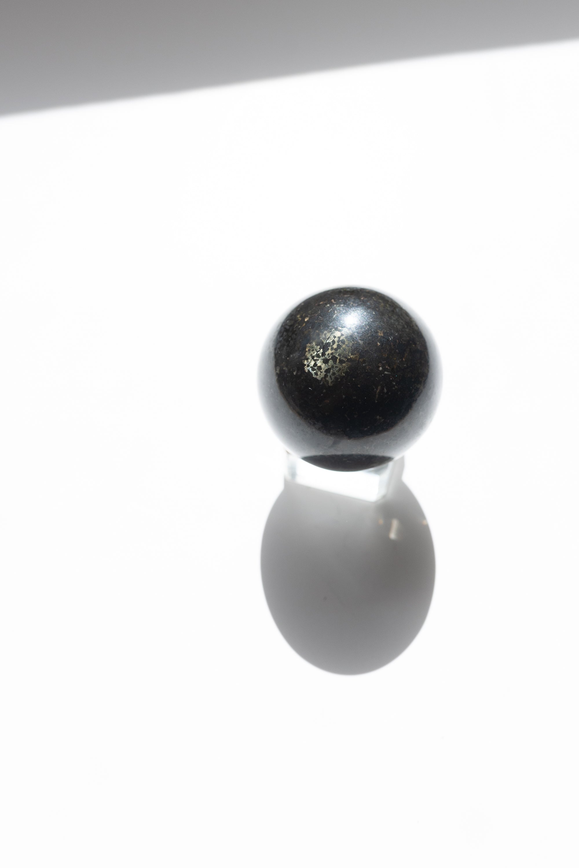 Nuummite Crystal Sphere #2 | Transformation • Psychic Protection • Ancient Wisdom