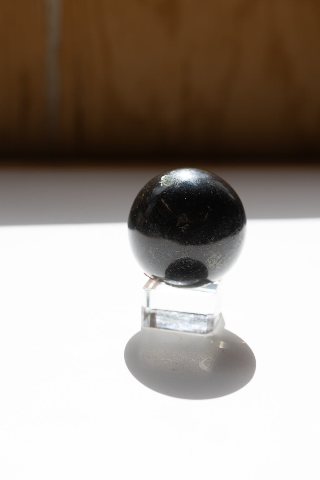 Nuummite Crystal Sphere #2 | Transformation • Psychic Protection • Ancient Wisdom