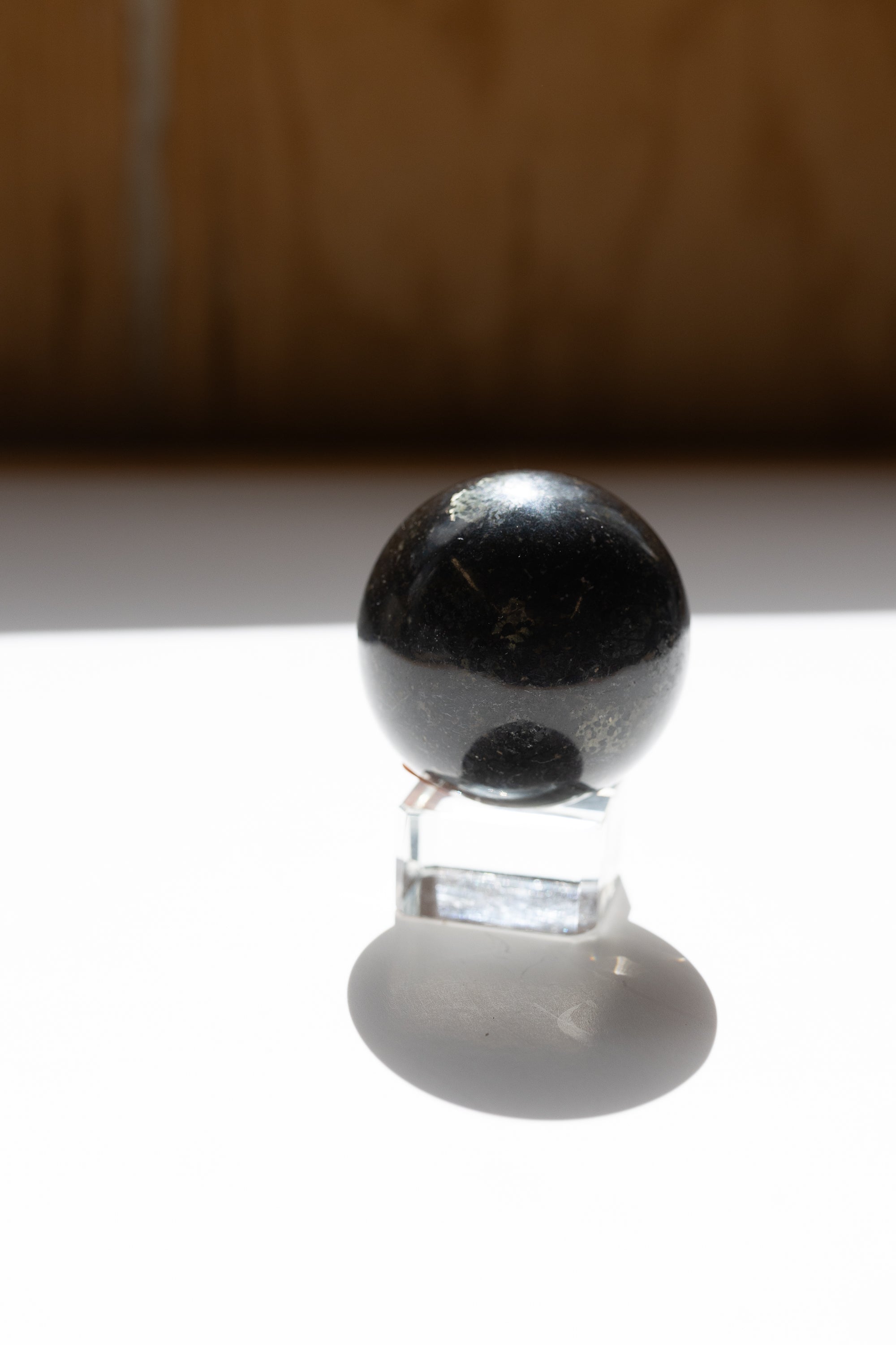 Nuummite Crystal Sphere #2 | Transformation • Psychic Protection • Ancient Wisdom