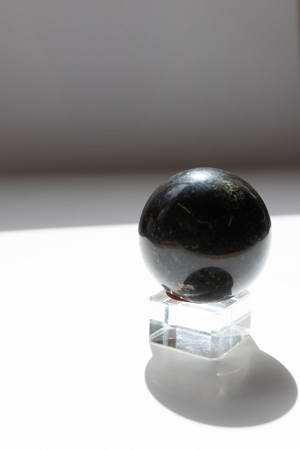Nuummite Crystal Sphere #2 | Transformation • Psychic Protection • Ancient Wisdom